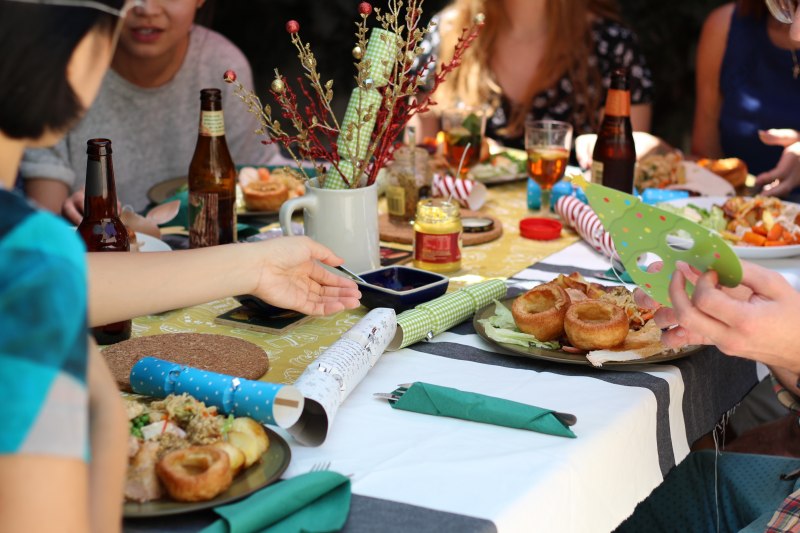 Eating with friends at a dinner table