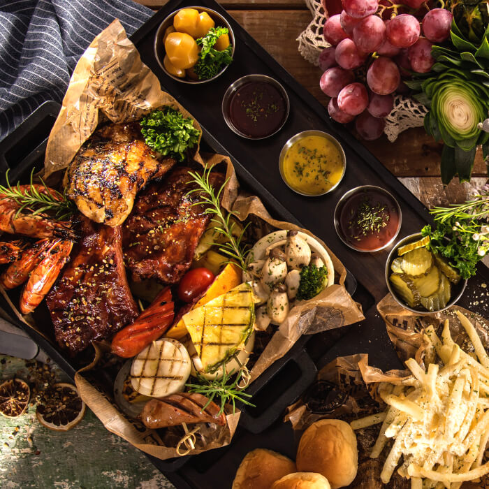 Meat platter with French fries and dipping sauce