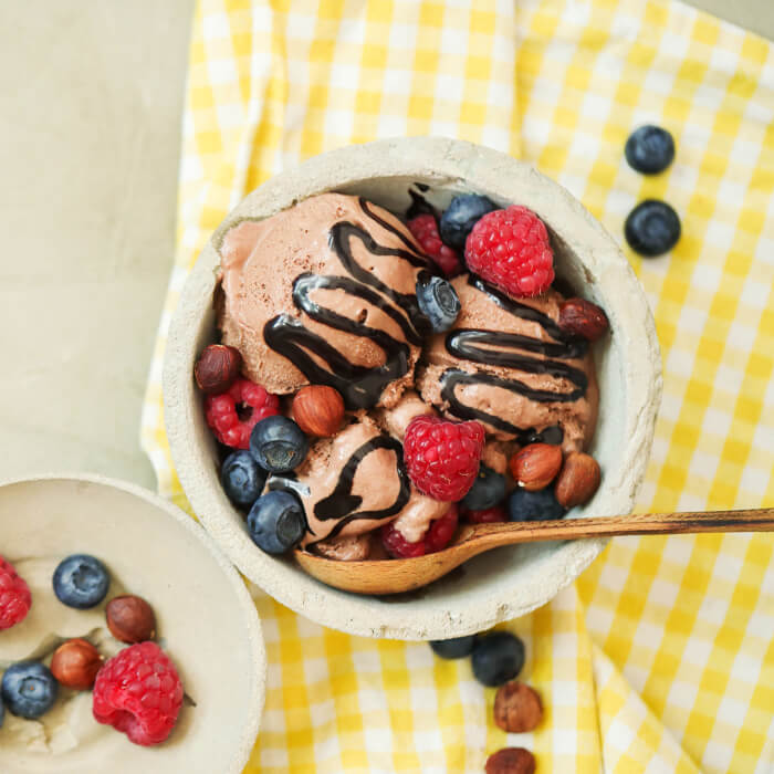 Chocolate ice cream with berries and chocolate sauce