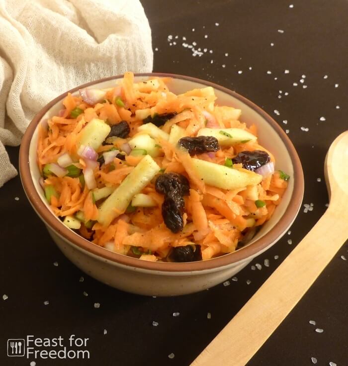 Fresh carrot and apple salad in a bowl