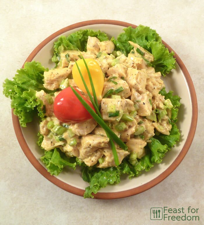 Chicken salad on a bed of lettuce on a plate