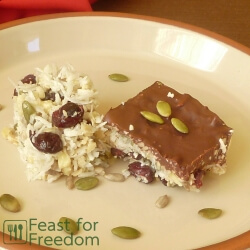 Coconut and nut squares, one that's plain, one that's topped with chocolate