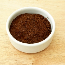 Homemade date sugar in a small bowl