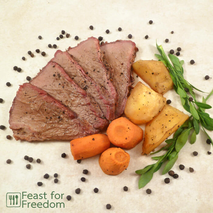 Roast beef with carrots and potatoes on a platter