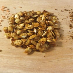 Roasted pumpkin seeds with sprinkled salt and spices