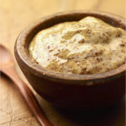 Whole grain dijon mustard in a wooden bowl